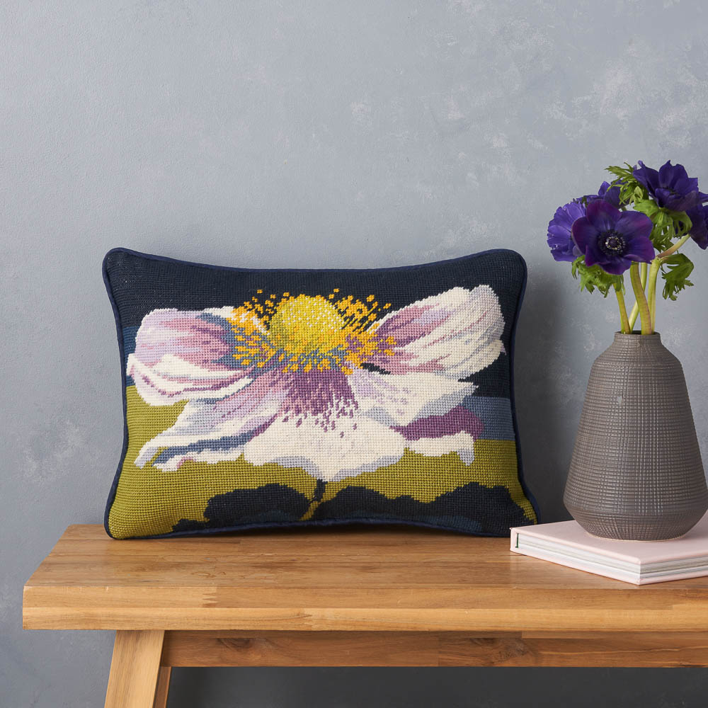 Japanese Anemone pillow on a wooden bench