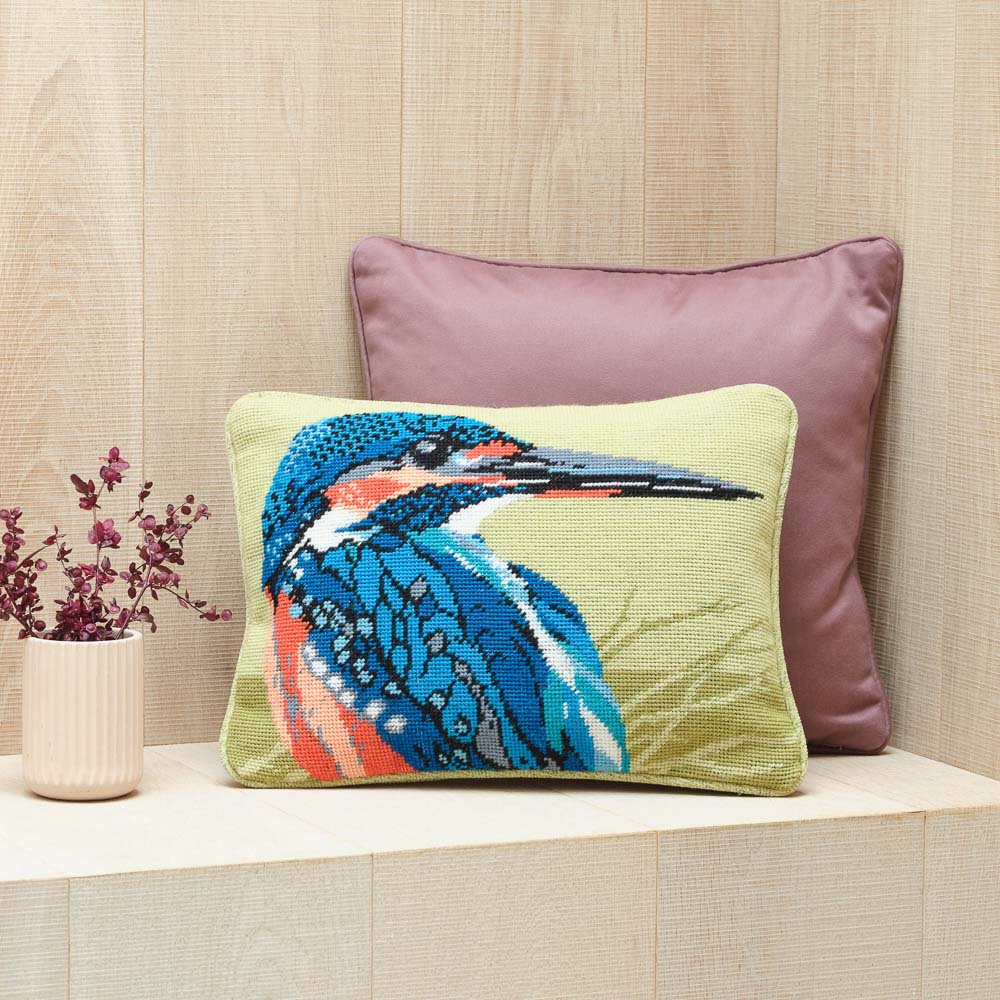 kingfisher pillow on a wooden box seat